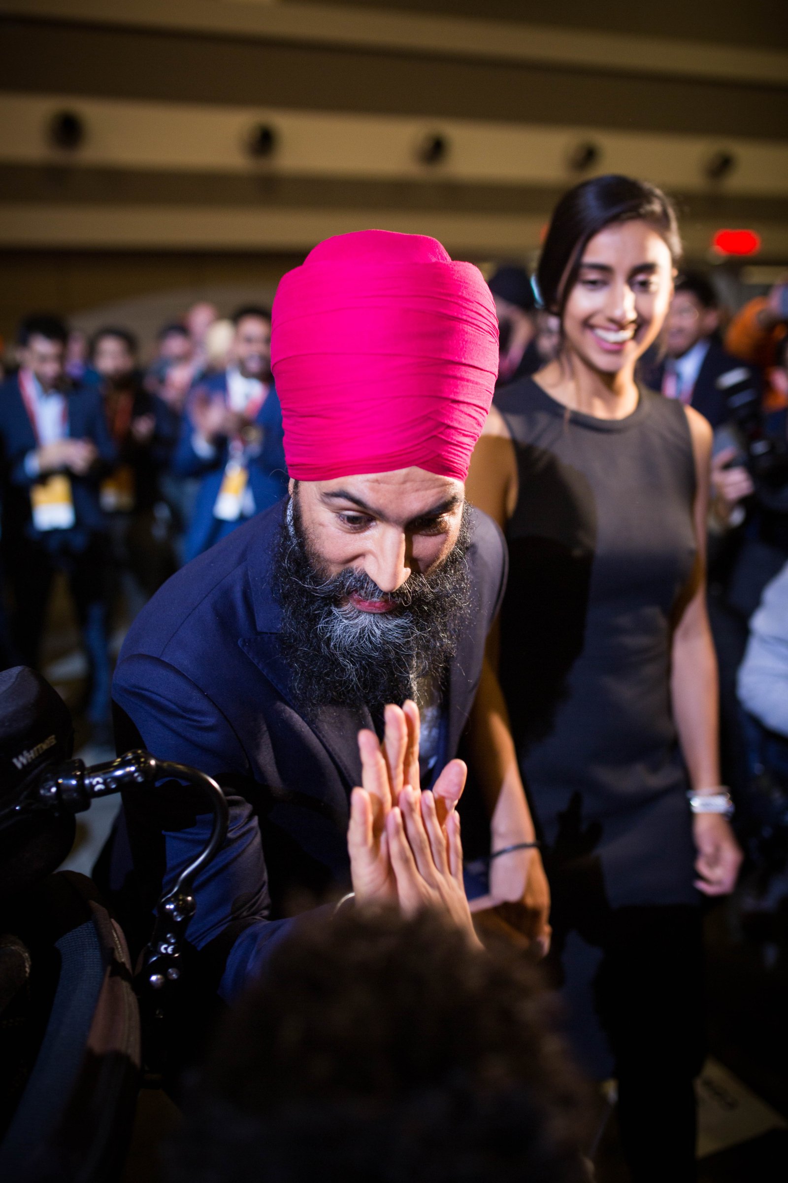NDP leader Jagmeet Singh, accompanied by his fiance Gurkiran Kaur, greet delegates at the NDP's national convention in Ottawa on Feb. 17, 2018. Photo by Alex Tétreault 