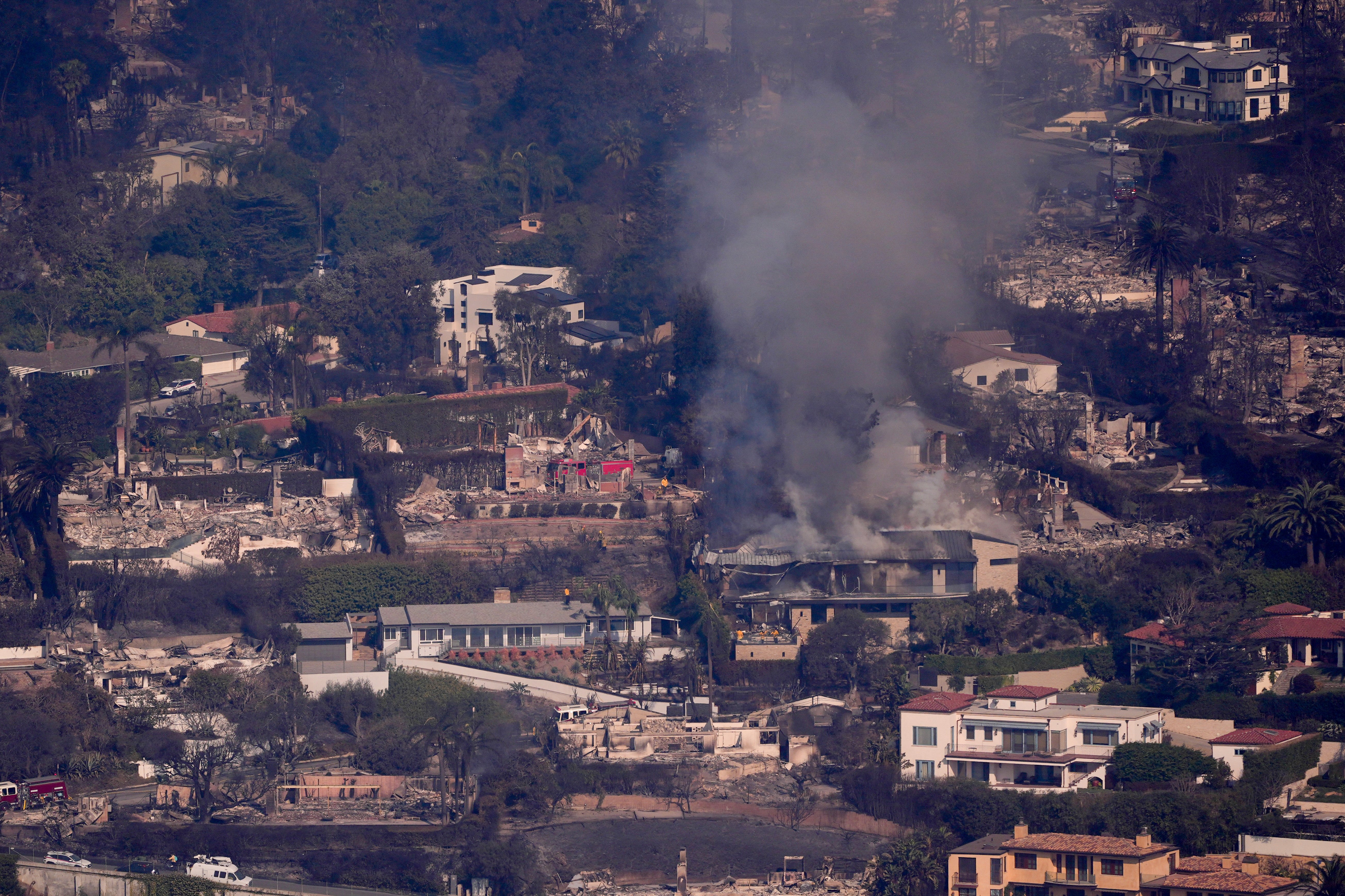 Firefighters start to gain the upper hand while Los Angeles grapples with the devastation