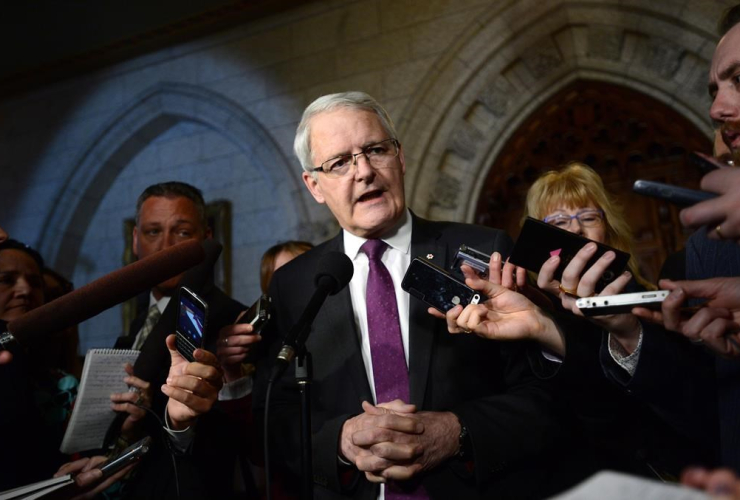 Transport Minister Marc Garneau speaks to reporters in the foyer of the House of Commons on Parliament Hill in Ottawa on Tuesday, March 21, 2017.