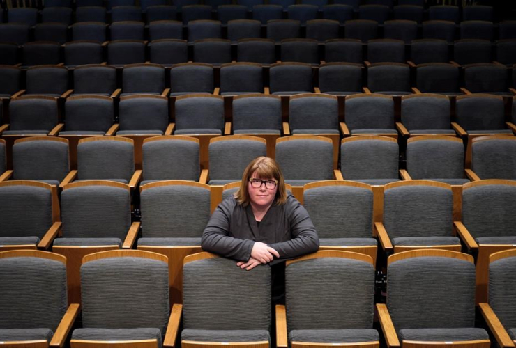 Vicki Stroich, Alberta Theatrre Projects executive director, sits in an empty theatre in Calgary, Alta., Thursday, March 16, 2017.