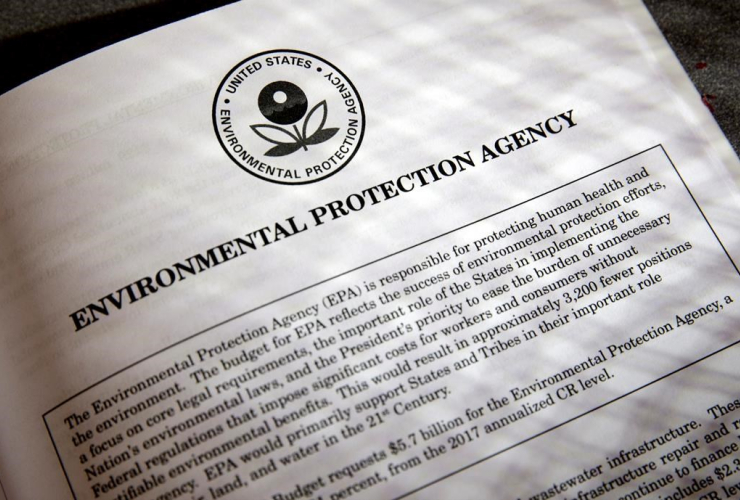 In this March 16, 2017, file photo, proposals for the Environmental Protection Agency (EPA) in President Donald Trump's first budget are displayed at the Government Printing Office in Washington.