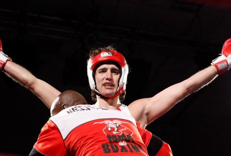 Justin Trudeau celebrates after defeating Conservative Senator Patrick Brazeau in a charity boxing match for cancer research, Saturday, March 31, 2012 in Ottawa.