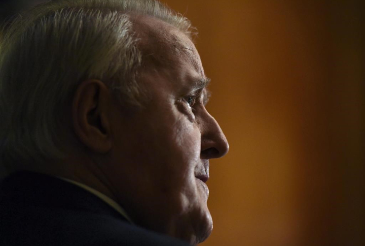 Former prime minister Brian Mulroney looks on during a media availability, before receiving the insignia of Commander of the National Order of the Legion of Honour from the Embassy of France, on Tuesday, Dec. 6, 2016 in Ottawa.