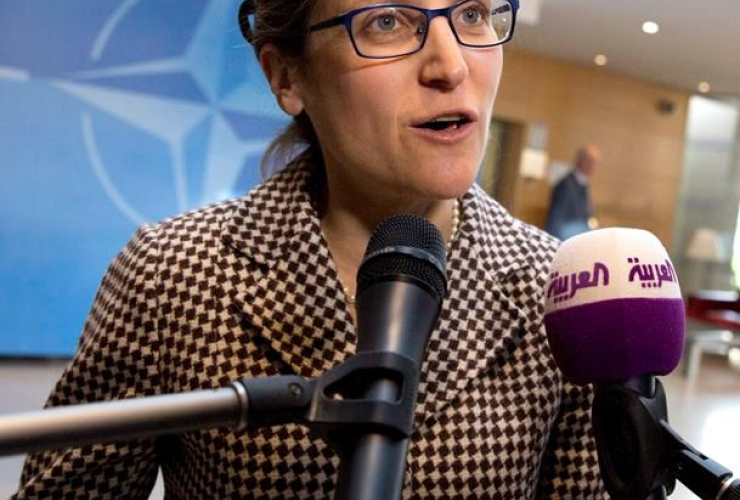 Canadian Foreign Minister Chrystia Freeland speaks with the media as she arrives for a meeting of NATO foreign ministers at NATO headquarters in Brussels on Friday, March 31, 2017.