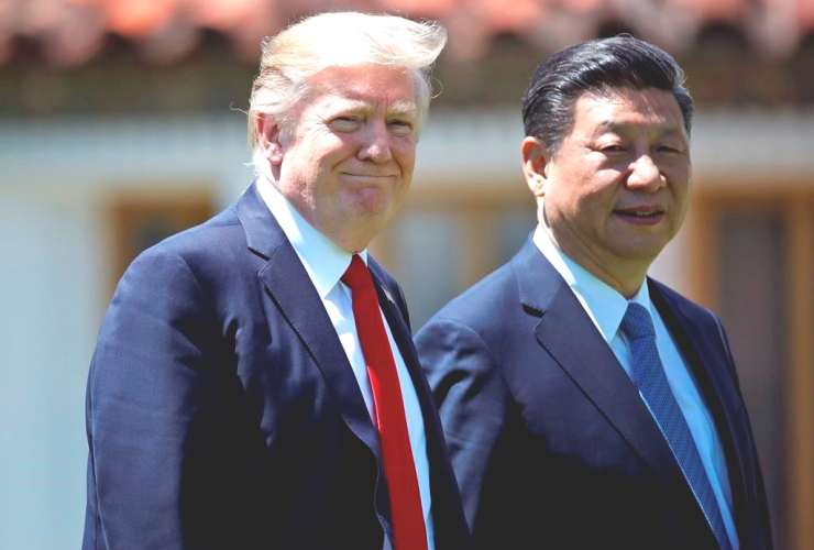 President Trump and Chinese President Xi Jinping walk together after their meetings at Mar-a-Lago, Friday, April 7, 2017, in Palm Beach, Florida.