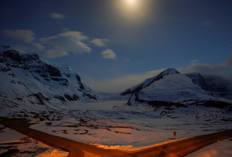 The Athabasca Glacier, centre, part of the Columbia Icefields in Jasper National Park, Alta., is seen in moonlight during a long exposure Wednesday, May 7, 2014.