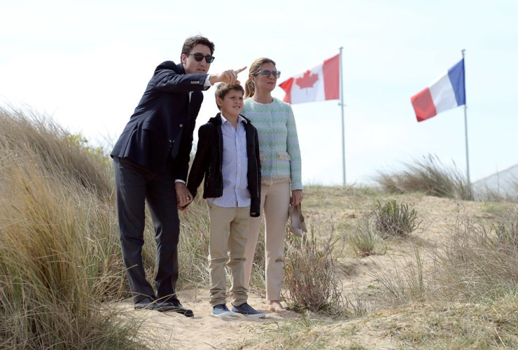 Prime Minister Justin Trudeau, left, Sophie Gregoire-Trudeau, right, and their son Xavier visit Juno Beach in Courseulles-sur-Mer, France, on Monday, April 10, 2017.