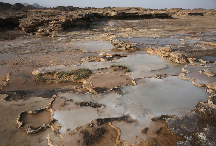 Travertine pools with white films of carbon fused with calcium