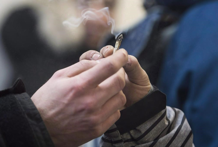 A marijuana joint is shared at Cannabis Culture in Montreal, Friday, December 16, 2016.