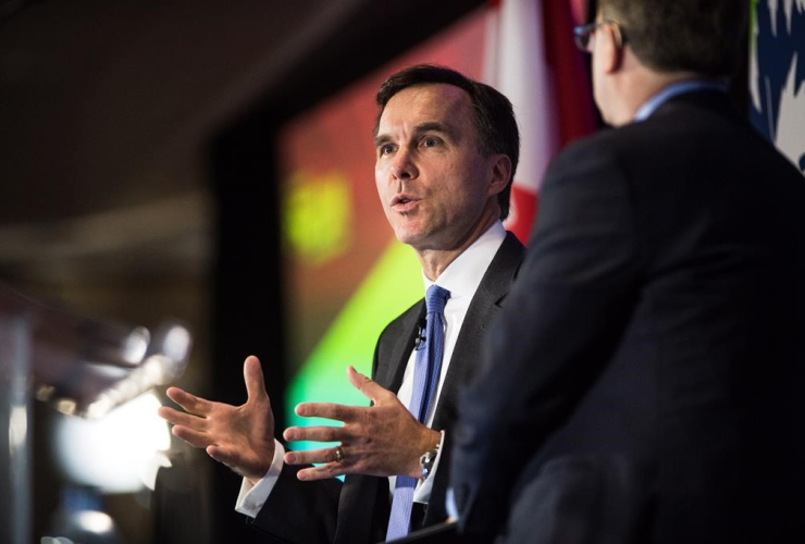 Finance Minister Bill Morneau speaks with Edward Greenspon at The Public Policy Forum Growth Summit in Toronto on Thursday, April 20, 2017.