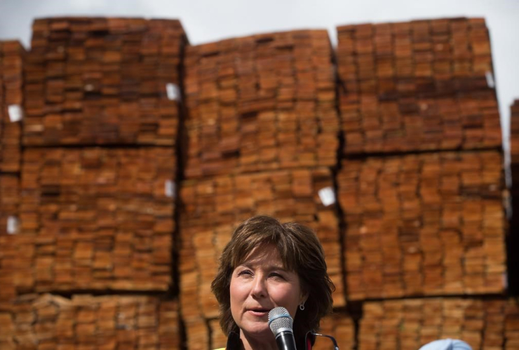 Liberal Leader Christy Clark addresses workers and local candidates while standing in front of stacks of western red cedar wood during a campaign stop at CedarLine Industries, a manufacturer of western red cedar products, Surrey, B.C., on April 24, 2017