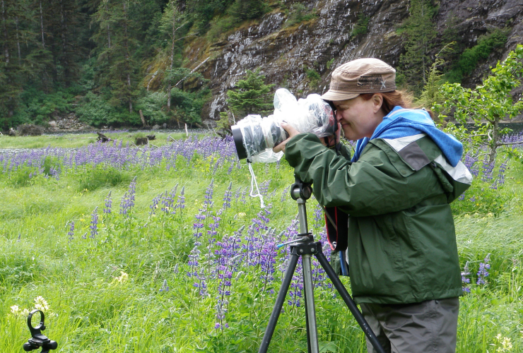 Trish Boyum taking photos in the Great Bear Rainforest