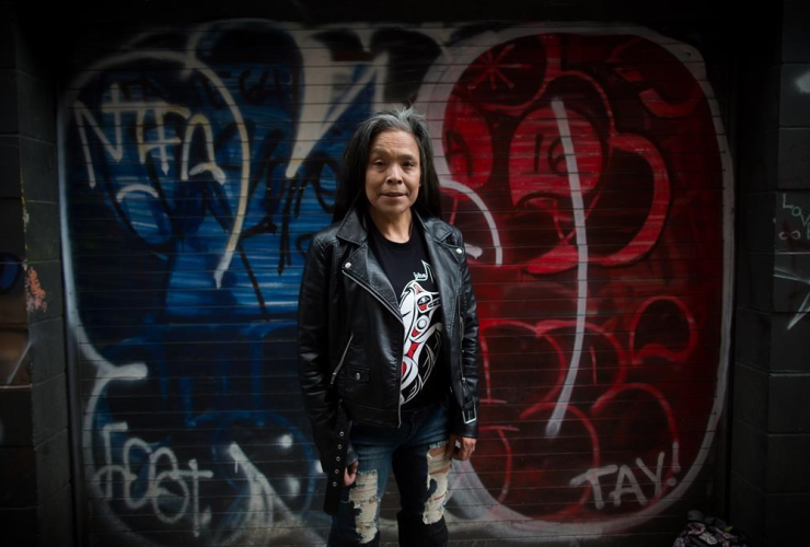 Maggy Gisle stands for a photograph in the Downtown Eastside of Vancouver, B.C., on Tuesday, May 9, 2017.