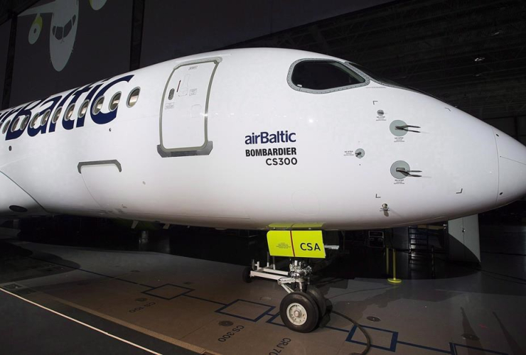 A Bombardier CS300 is shown during a ceremony to mark the first delivery of the commercial jetliner to Air Baltic in Mirabel, Que., Monday, November 28, 2016