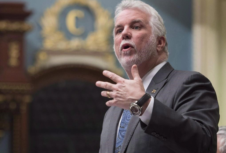 Quebec Premier Philippe Couillard responds to Opposition questions over former premier Jean Charest and Marc Bibeau, during question period Tuesday, April 25, 2017 at the legislature in Quebec City.