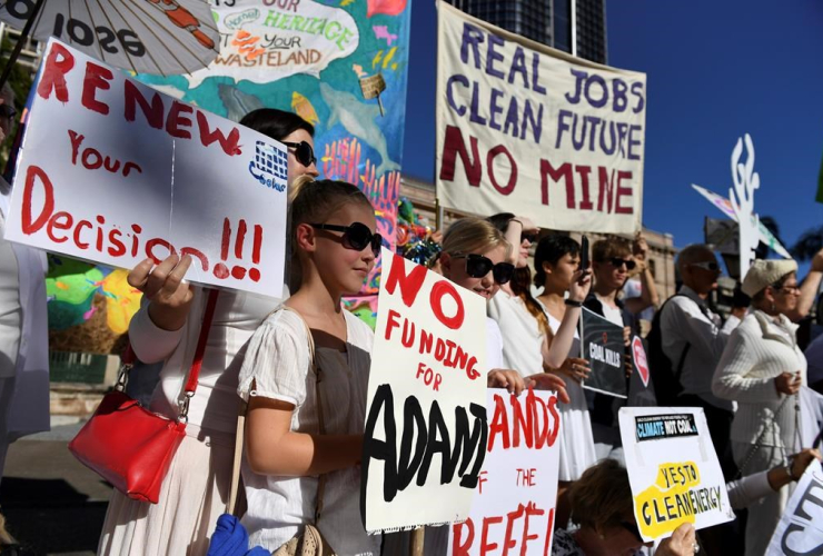 In this May 25, 2017 photo, environmental activists voice their opposition to Indian miner Adani's proposed Carmichael coal mine, outside Parliament House in Brisbane, Australia. File photo by The Associated Press