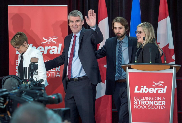 Nova Scotia Premier Stephen McNeil waves as he heads from the stage with his wife Andrea, daughter Colleen and son Jeffrey after addressing supporters at his election night celebration in Bridgetown, N.S.