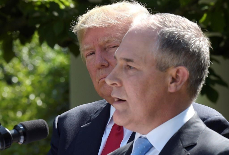 President Donald Trump listens as EPA Administrator Scott Pruitt speaks in the Rose Garden of the White House in Washington, on June 1, 2017