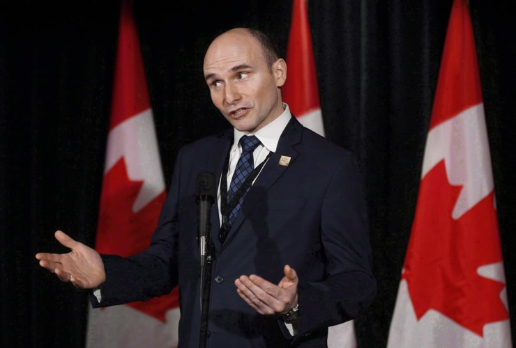 Social Development Minister Jean-Yves Duclos speaks to reporters at a Liberal cabinet retreat in Calgary, Alta., Tuesday, Jan. 24, 2017.