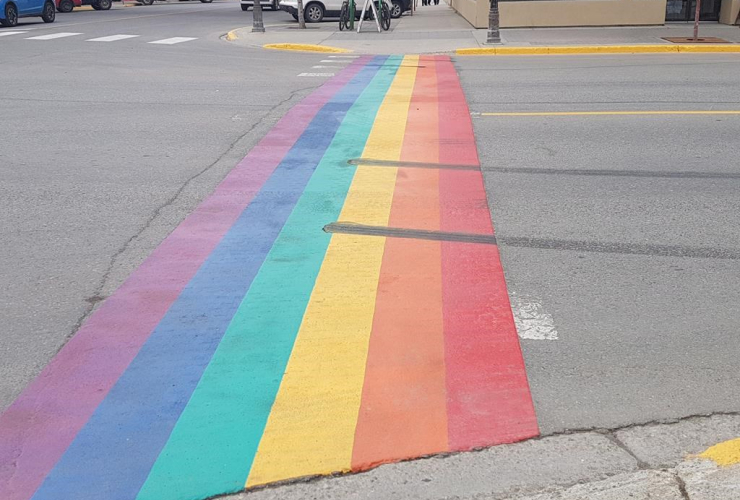 Tire burnout marks are seen on a crosswalk painted with the colours of the rainbow in honour of the LGBTQ community, on Tuesday, June 13, 2017, in Whitehorse, Yukon Territory. Handout photo by CKRW/Tim Kucharuk