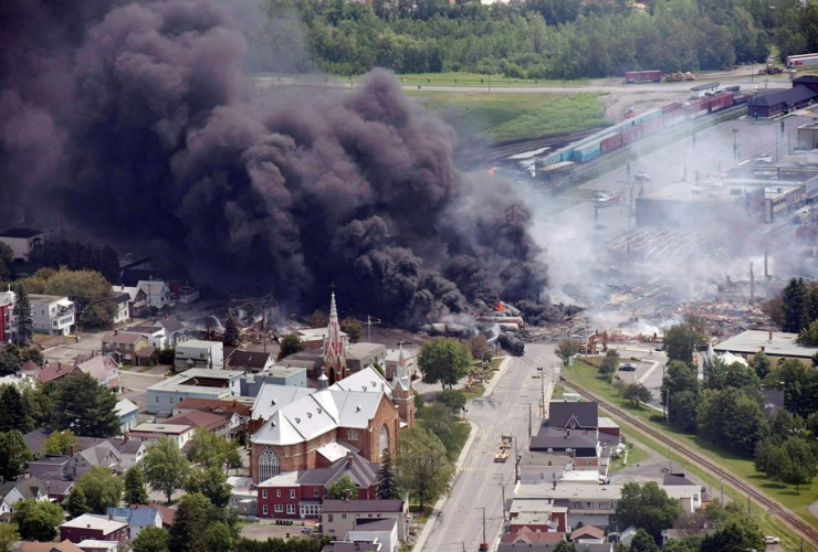 smoke, railway cars, crude oil, derailing, downtown Lac Megantic, Que.,