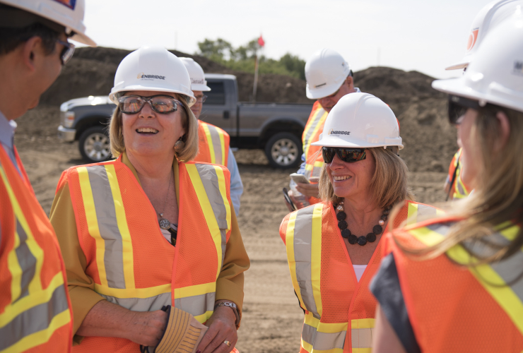 Alberta Energy Minister Margaret McCuaig-Boyd (left) and Premier Rachel Notley tour Enbridge's Line 3 pipeline replacement site at Hardisty, Alta. on Aug. 10, 2017.