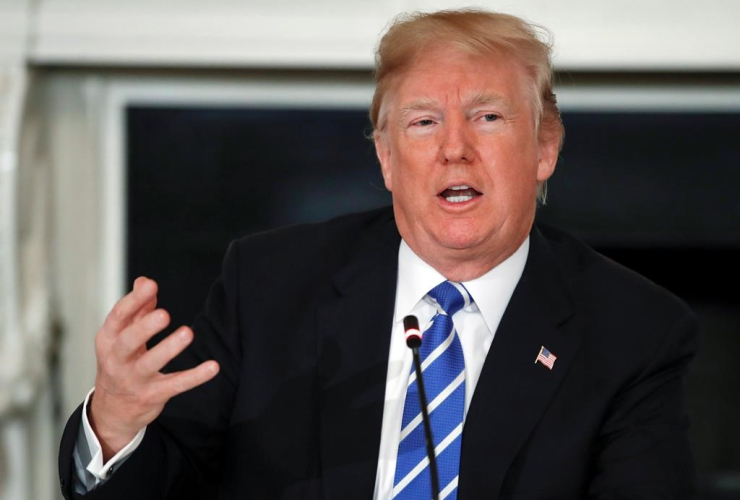 President Donald Trump speaks in the State Dining Room of the White House in Washington, Monday, Feb. 12, 2018. The White House is dowmplaying a threat from President Donald Trump to impose new import tax.