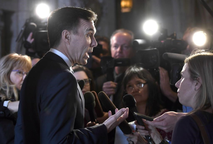 Minister of Finance Bill Morneau speaks to reporters after leaving a cabinet meeting on Parliament Hill in Ottawa on February 6, 2018. Photo by The Canadian Press/Justin Tang