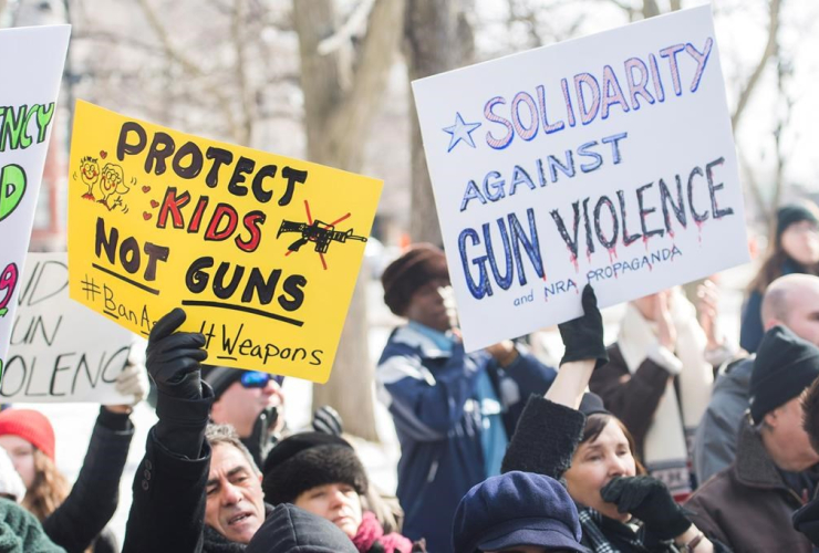 People, signs, March of Our Lives, rally, solidarity, U.S. gun control movement, Montreal, 