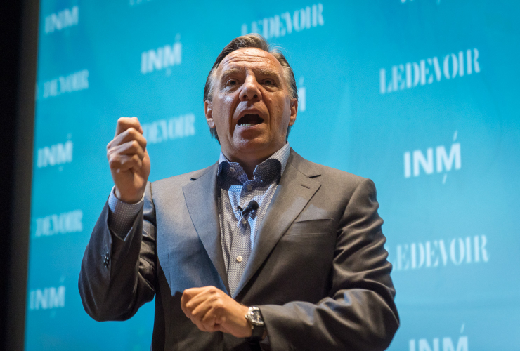 François Legault of Coaltion Avenir Québec takes the stage at an event on August 17 at Concordia University in Montreal