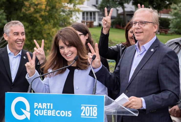 PQ Leader Jean-Francois Lisee, Veronique Hivon, victory sign, 