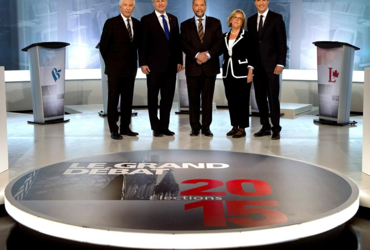 Gilles Duceppe, from left to right, Stephen Harper, Tom Mulcair, Elizabeth May and Justin Trudeau pose for photos before the French-language leaders' debate in Montreal on September 24, 2015. File photo by The Canadian Press/Adrian Wyld