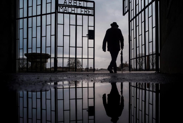 man, Sachsenhausen, Nazi death camp, Arbeit macht frei, work sets you free, International Holocaust Remembrance Day, Oranienburg, Germany, 