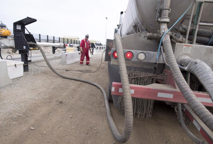 worker, fills, truck, Shell Sunset water hub, Groundbirch Saturn natural gas plant, 