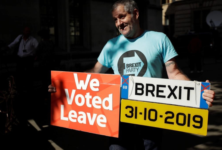 Brexit supporter, placard, mock car number plate, Supreme Court, London,