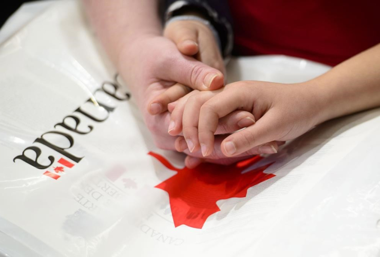 mother, hands, daughter, new Canadians, Oath of Citizenship, 