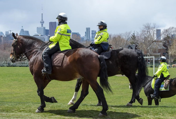 Toronto Police Mounted Unit officers, patrol, city park, Toronto,