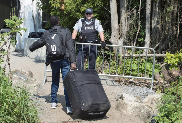 asylum seeker, RCMP officer, border, Canada, United States,