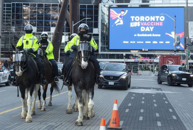 Police patrol, COVID-19 vaccine clinic, Scotiabank Arena, Toronto, 