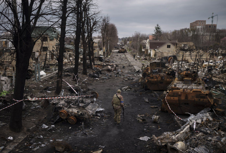 Ukrainian serviceman, Russian tanks, Bucha, Ukraine,