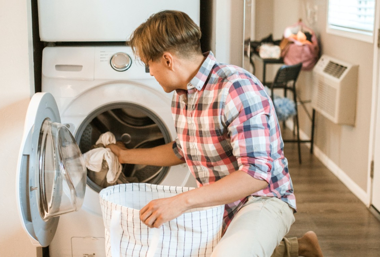 man does laundry