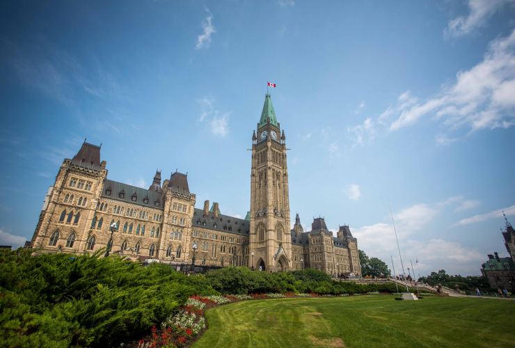 a wide shot of Canadian parliament in Ottawa on a sunny day