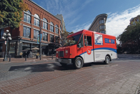 A Canada Post truck makes deliveries in Vancouver. Photo by Canada Post