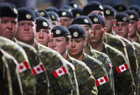 Members of the Canadian Armed Forces march during the Calgary Stampede parade in Calgary, Friday, July 8, 2016.