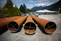 pipes sit in front of a construction site