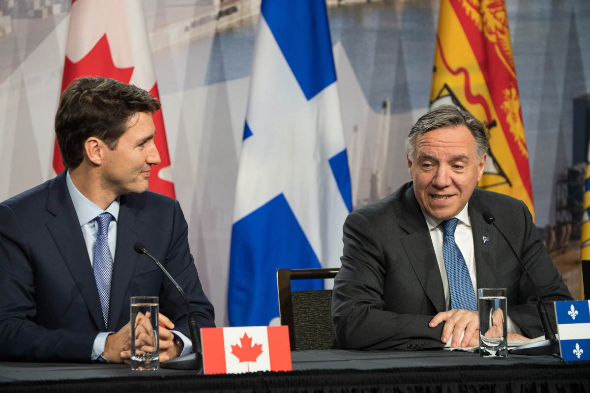 Prime Minister Justin Trudeau and Quebec Premier François Legault speak during the First Ministers' Meeting in Montreal on Dec. 7, 2018. Photo by Josie Desmarais