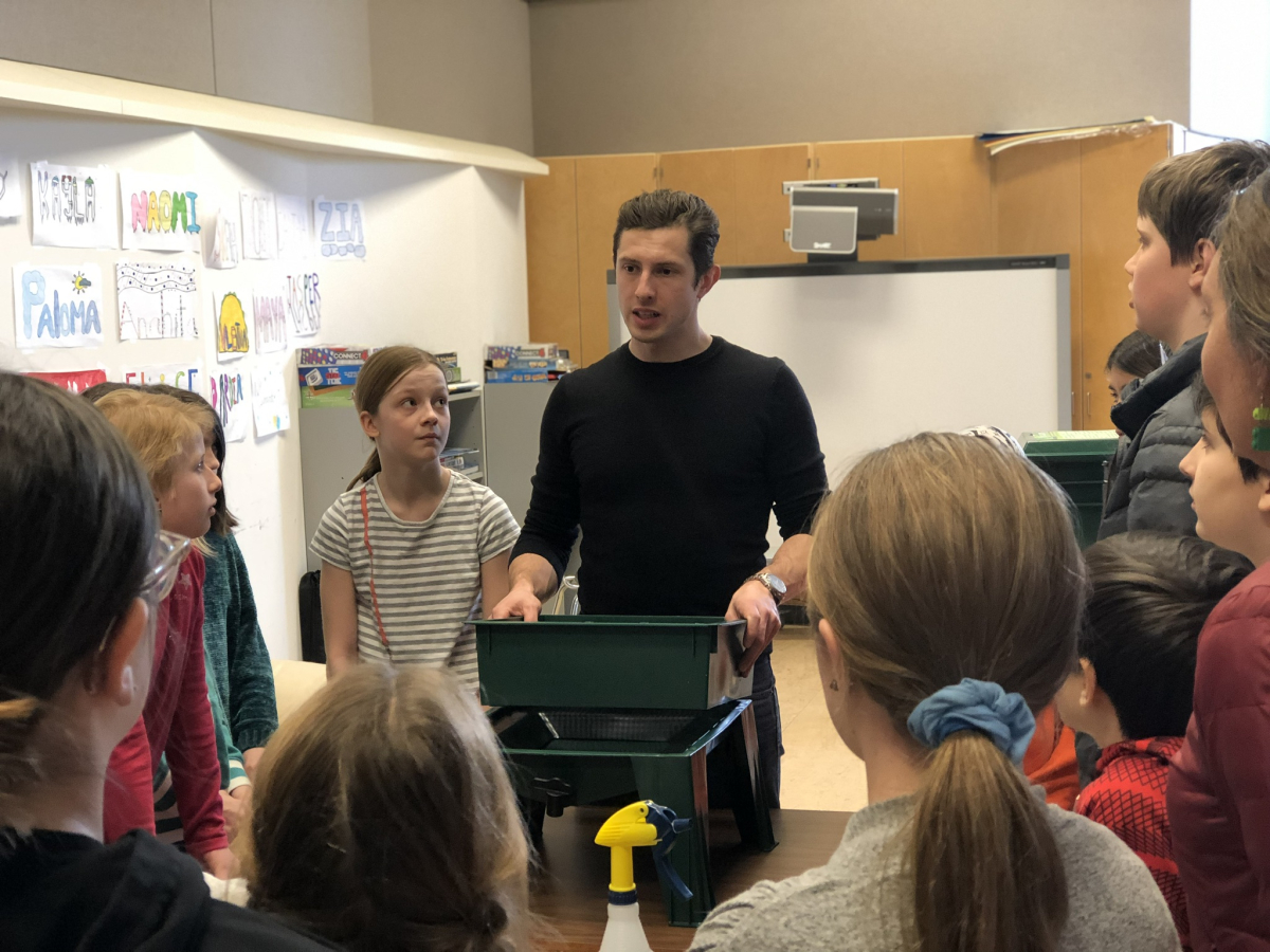 Gallet teaches a group of students about worm composting. Photo courtesy Econova