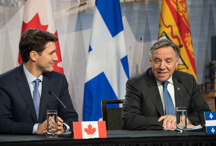 Prime Minister Justin Trudeau and Quebec Premier François Legault speak during the First Ministers' Meeting in Montreal on Dec. 7, 2018. Photo by Josie Desmarais