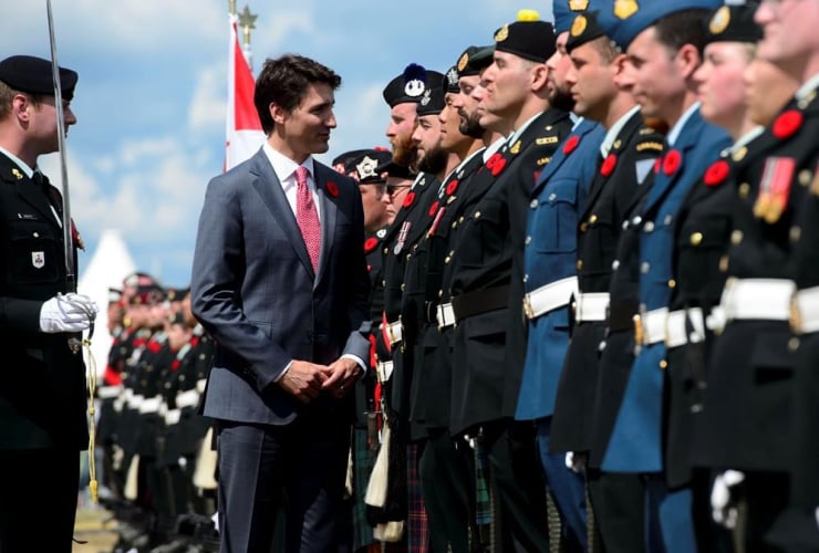 Prime Minister Justin Trudeau, inspects, honour guard, D-Day 75th Anniversary Canadian National Commemorative Ceremony, Juno Beach, Courseulles-Sur-Mer, France,