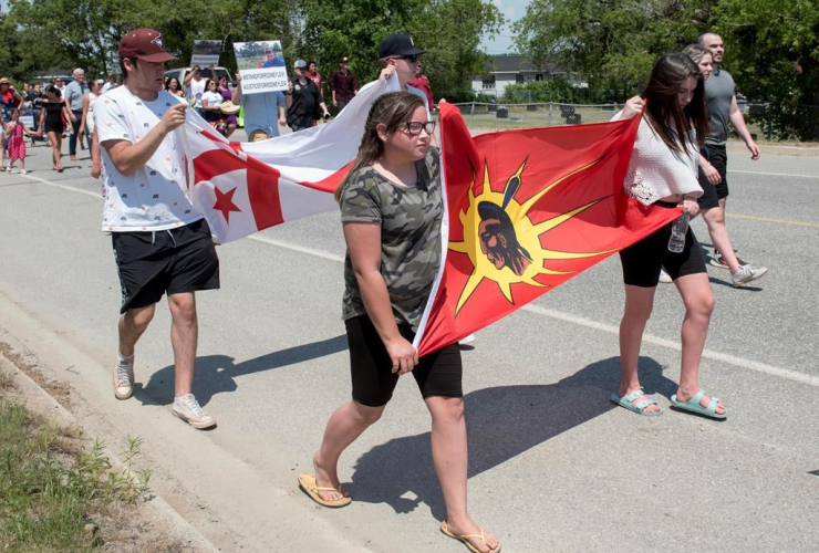 People walk to honour Rodney Levi in Red Bank, New Brunswick on Friday, June 19, 2020. File photo by The Canadian Press/Stephen MacGillivray